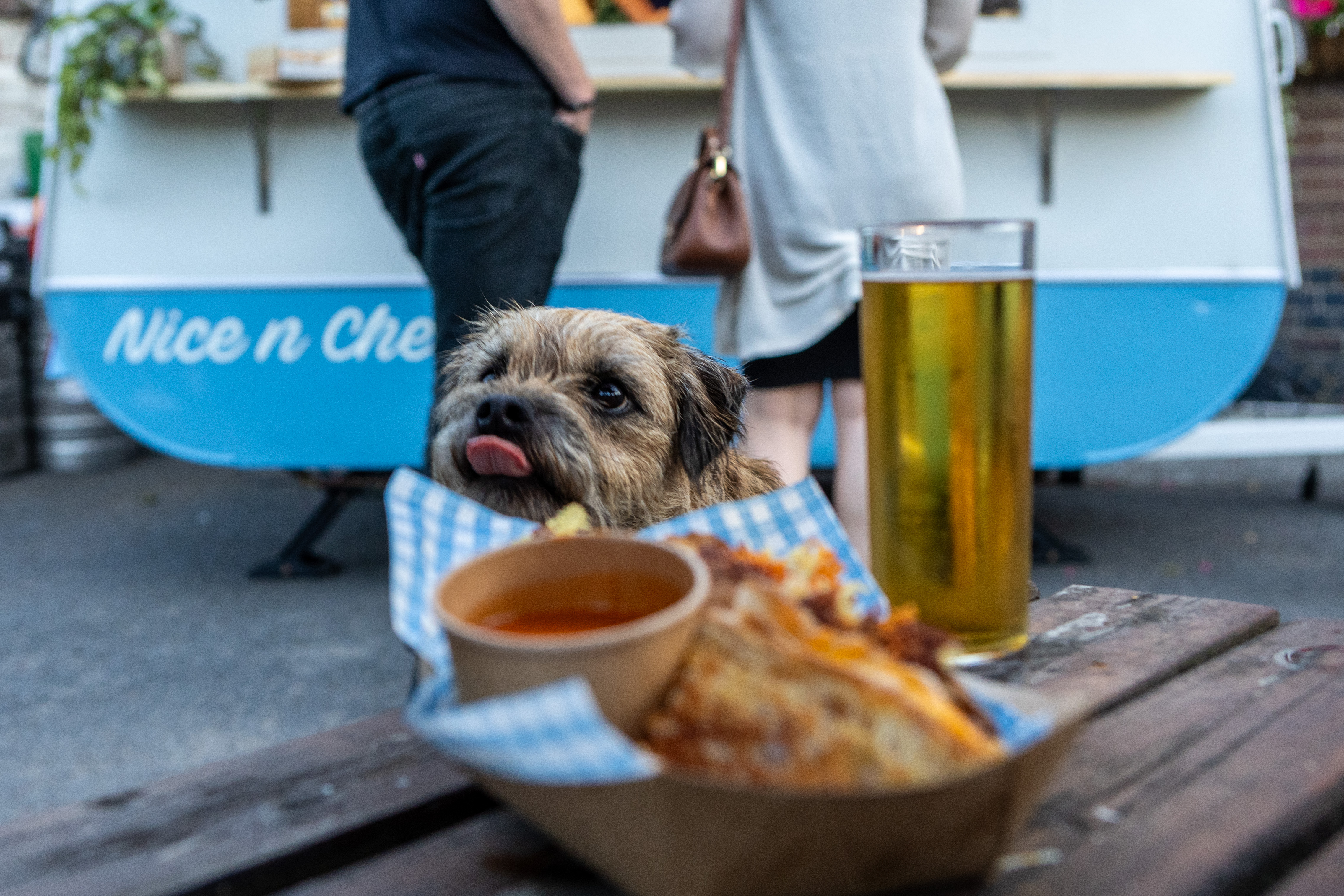 Cheese toastie in the foreground and a vintage 70's caravan in the background providing event catering.